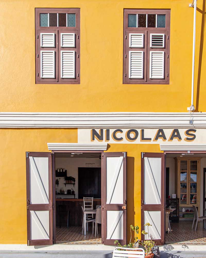 A bright yellow cafe in San Nicolas