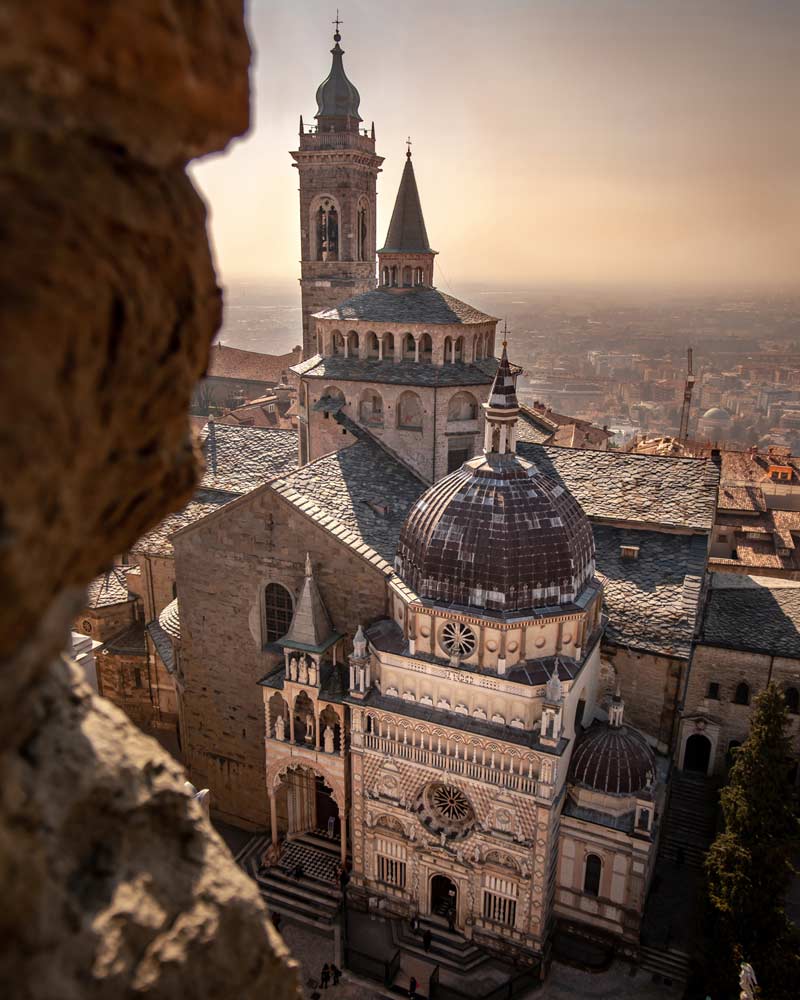 The cathedral of Bergamo at sunset, as seen from a high up viewing platform