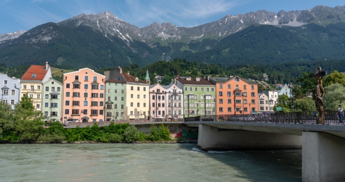 Colourful houses by the river during summer in Innsbruck