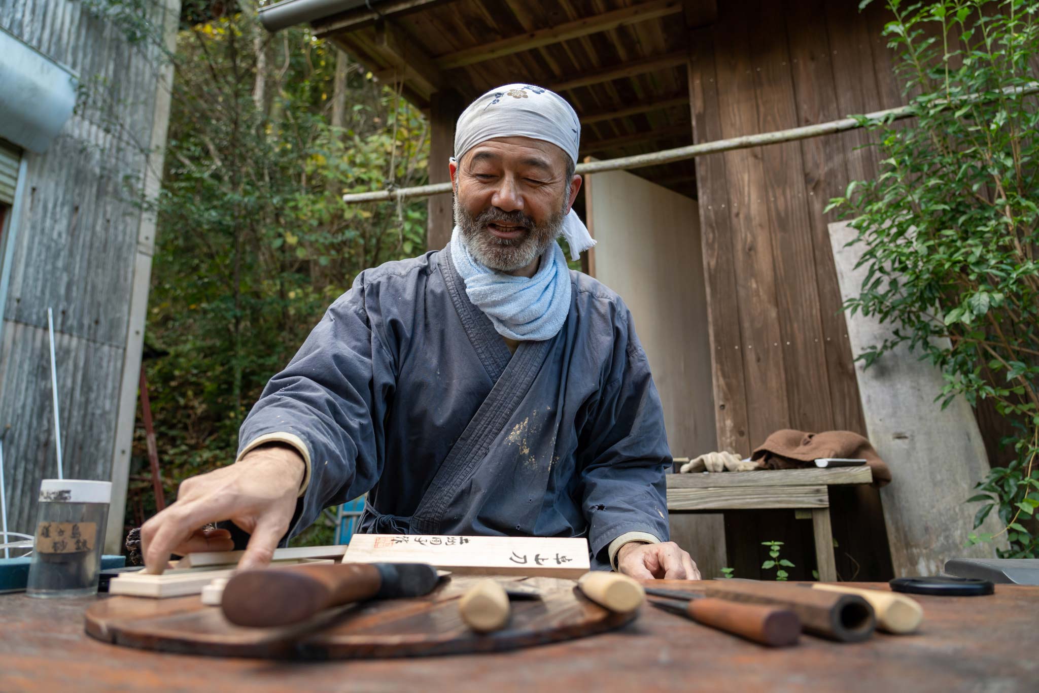 Shopping from a local knife craftsman's smal; studio in Japan