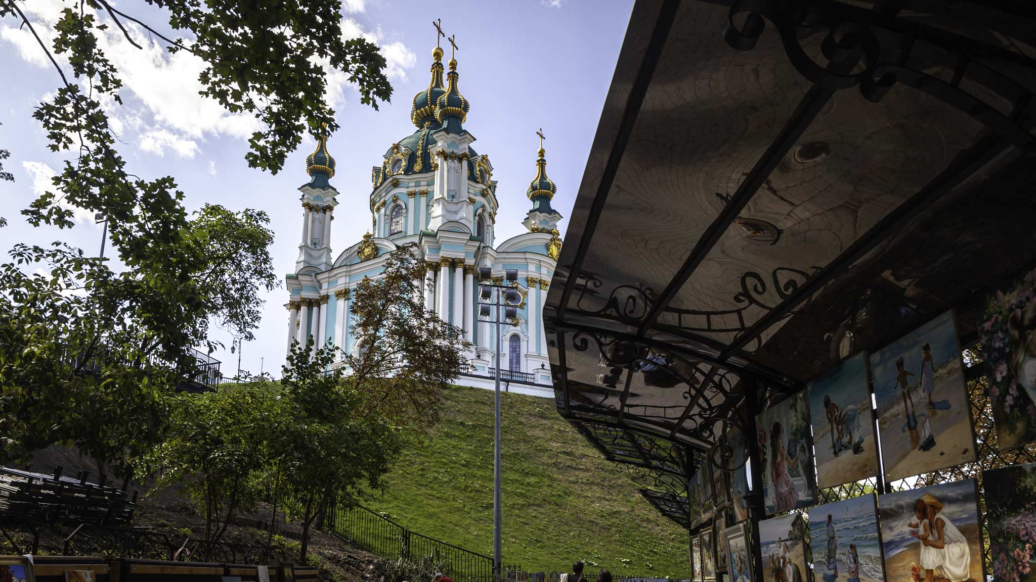 A cathedral in Kyiv Ukraine framed by an art stool on the bottom right