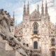 Milano Duomo with a lion statue in the foreground