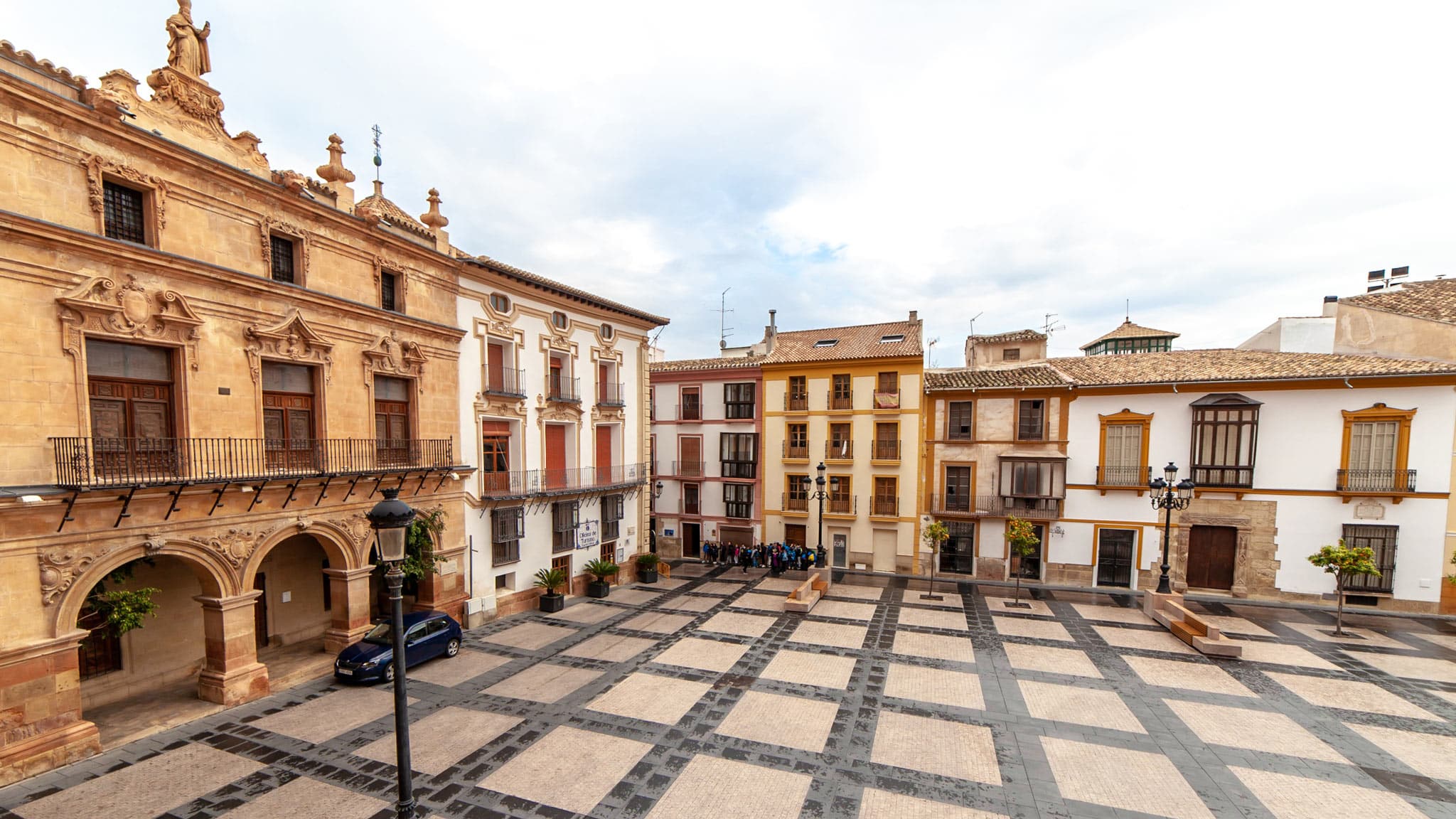 A tiled square in Lorca surrounded by buildings