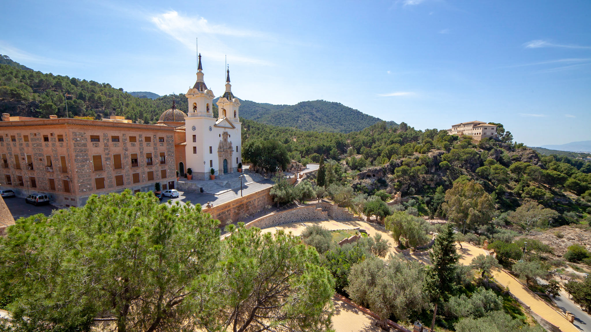 Views over a sanctuary to the left and the green hills with another building on the right just outside Murcia Spain