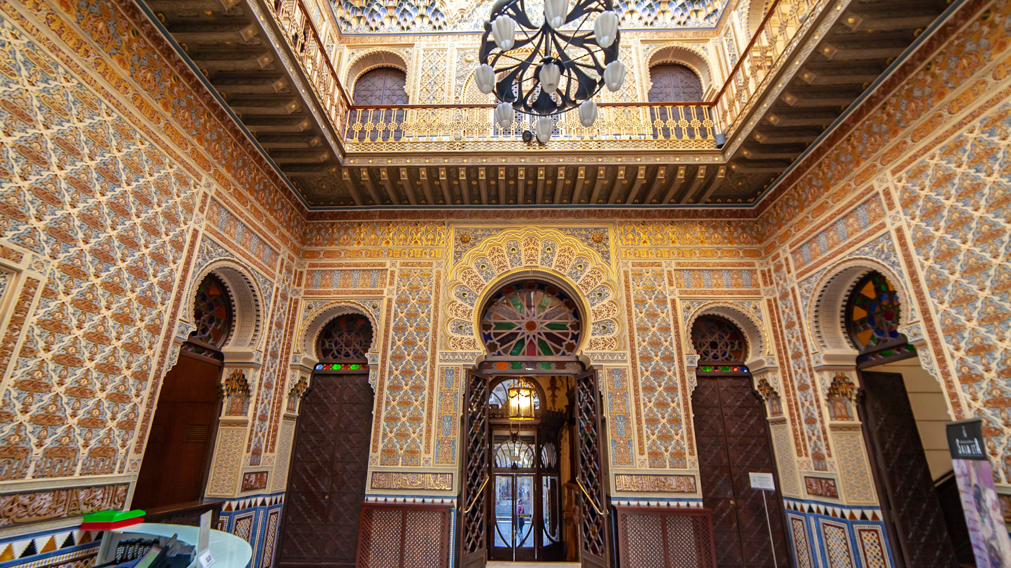 An ornate room in mainly gold and an Islamic style of design in the Real Casino of Murcia