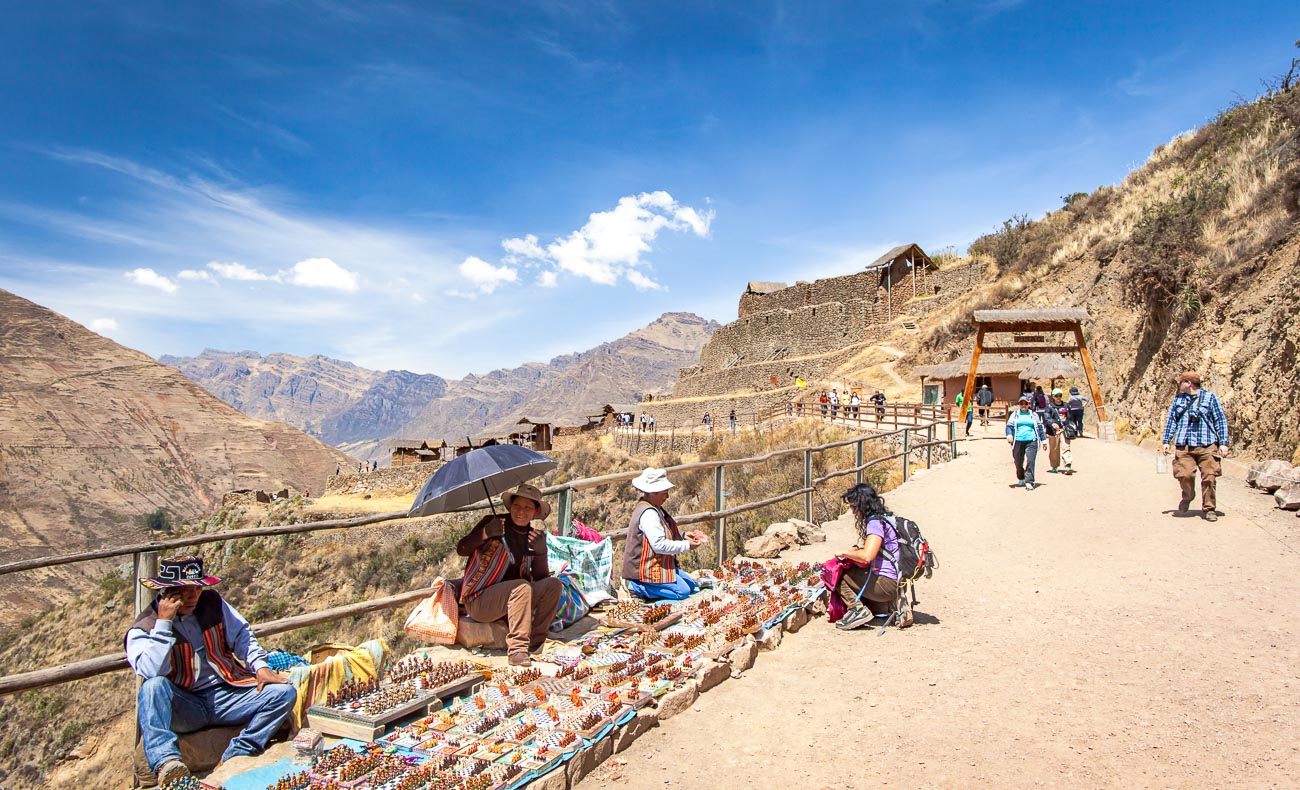 Locals sell goods on the path to Pisac ruins