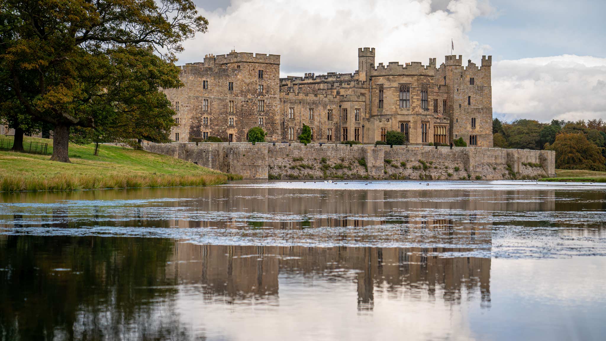 Raby Castle reflected on the water around it