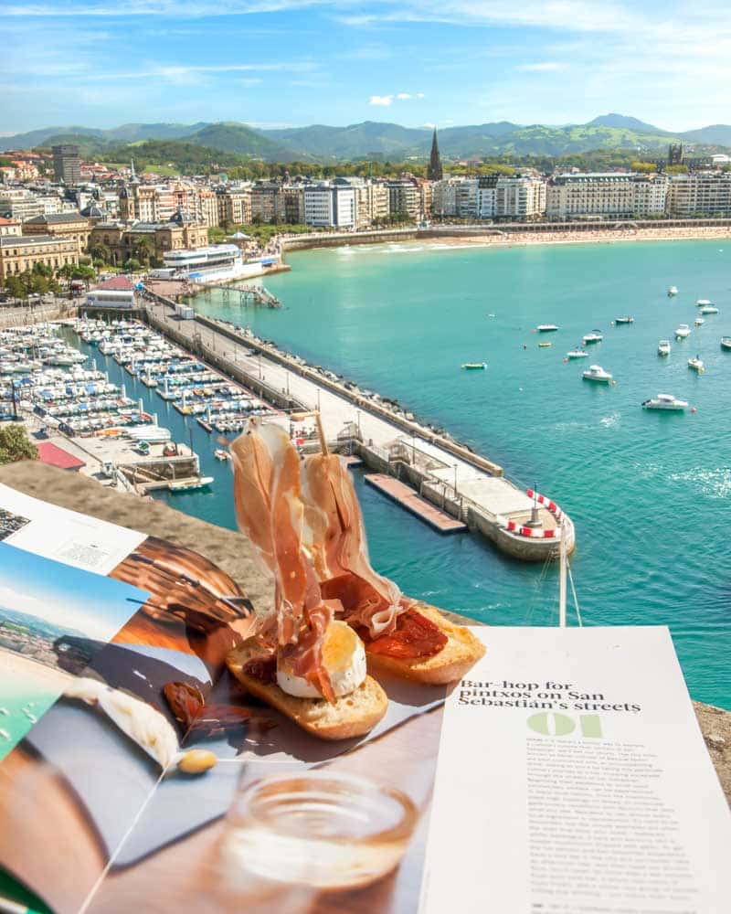 Views over the harbour in San Sebastian with pinxtos in the foreground