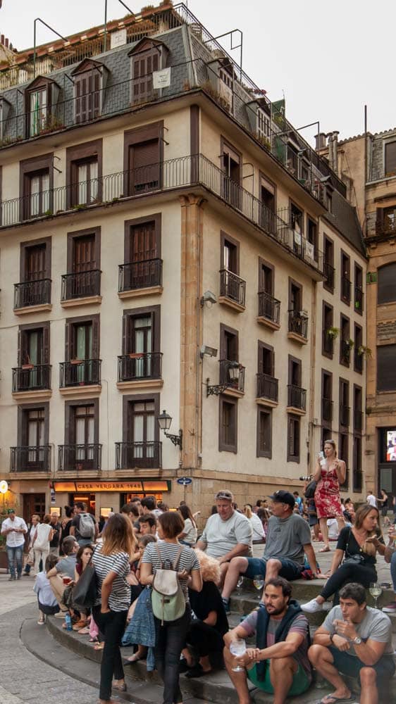 People gather in a square for drinks in the Basque Country