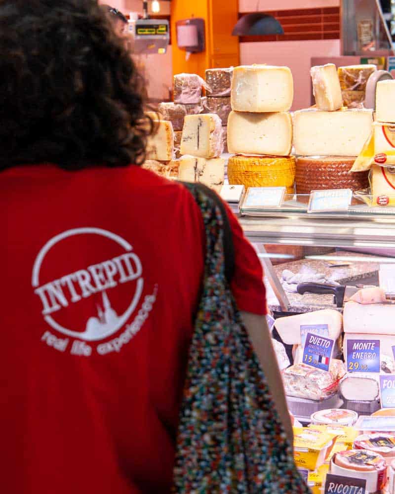 Woman in front of cheese in San Sebastian