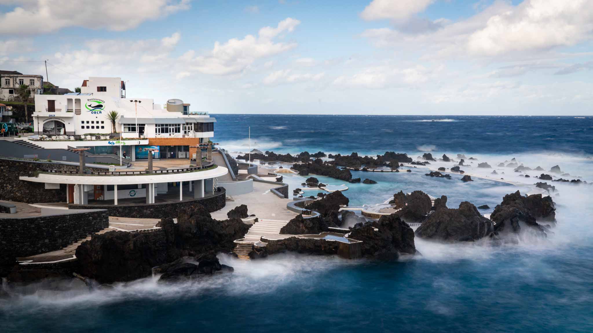 The ocean swimming pools of Porto Moniz surrounded by the sea and light waves