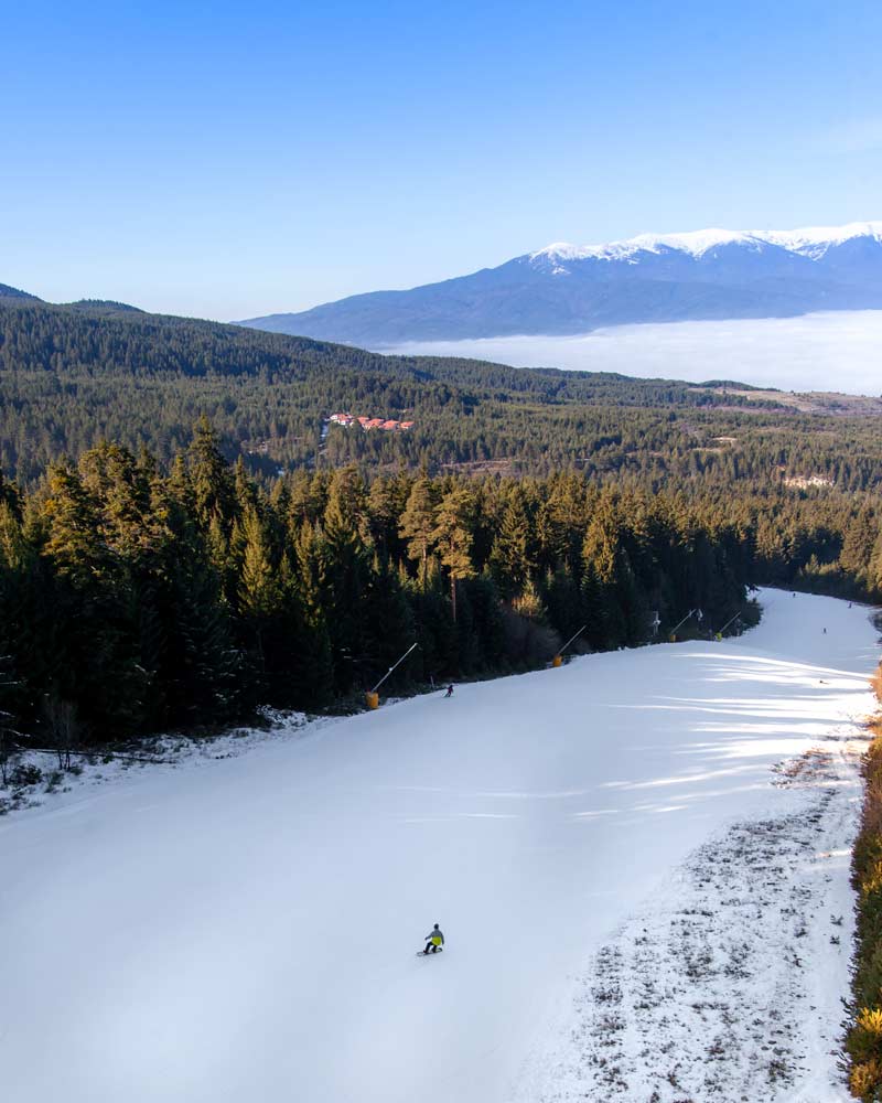 Snowboarding down the piste in Bansko Bulgaria