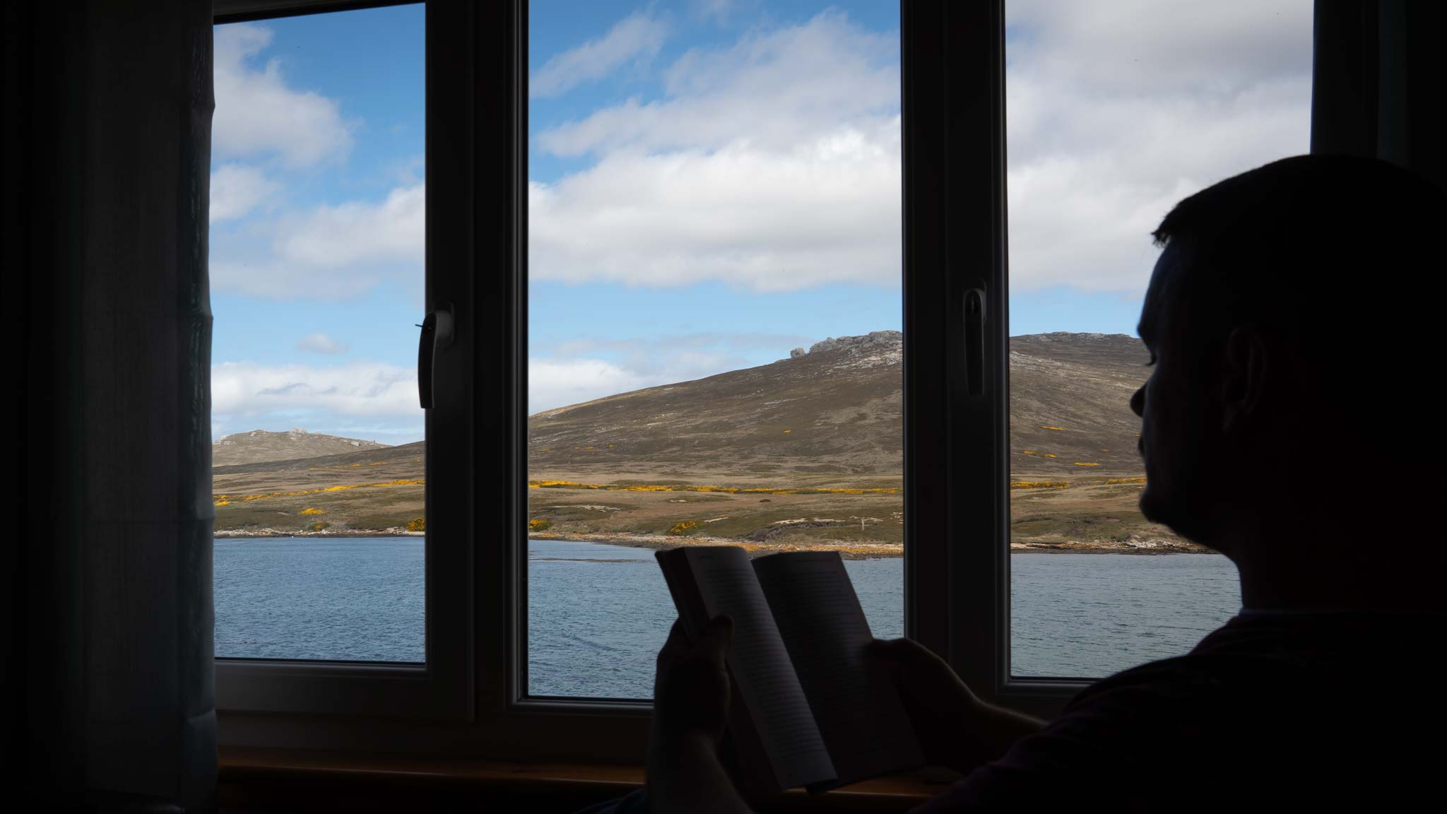 Enjoying a book and the views on Weddell Island